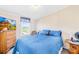 Relaxing bedroom features blue bedding, natural light, and ample space at 590 County Line Rd, Stony Point, NC 28678