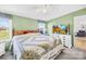 Comfortable bedroom with a television, ample storage, and soft natural light at 590 County Line Rd, Stony Point, NC 28678