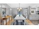 Bright dining room features a modern chandelier and charming views of the outdoors at 590 County Line Rd, Stony Point, NC 28678