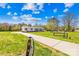 Charming home with well-manicured lawn, stone driveway and a picturesque country setting, blending comfort and rural beauty at 590 County Line Rd, Stony Point, NC 28678