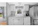 Efficient kitchen boasts white cabinetry and essential appliances for convenient meal prep at 590 County Line Rd, Stony Point, NC 28678