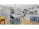 Bright eat-in kitchen boasts a modern chandelier and charming views of the outdoors at 590 County Line Rd, Stony Point, NC 28678