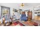 Cozy living room features a ceiling fan, neutral walls, and warm, inviting decor at 590 County Line Rd, Stony Point, NC 28678
