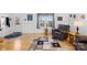 Spacious living room features hardwood floors, a patterned rug and bright natural light at 590 County Line Rd, Stony Point, NC 28678