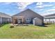 Well-maintained backyard with a fire pit, shed, and patio seating area, perfect for outdoor entertaining at 7316 Strawberry Fields Ln, Charlotte, NC 28278