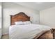 Bedroom with decorative bedframe and white bedding at 7316 Strawberry Fields Ln, Charlotte, NC 28278