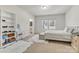 Bright and airy bedroom with carpet, natural light, and ensuite bathroom at 7316 Strawberry Fields Ln, Charlotte, NC 28278