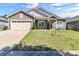 Charming single-Gathering home with a well-manicured lawn and a two-car garage at 7316 Strawberry Fields Ln, Charlotte, NC 28278