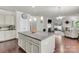 Bright open kitchen with a granite island and modern pendant lighting at 7316 Strawberry Fields Ln, Charlotte, NC 28278
