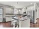 Modern kitchen featuring stainless steel appliances, granite countertops, and a large island at 7316 Strawberry Fields Ln, Charlotte, NC 28278