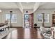 Bright living room with hardwood floors, large windows, and stylish furnishings at 7316 Strawberry Fields Ln, Charlotte, NC 28278