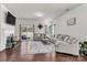 Bright living room with a fireplace, backyard views, and comfortable seating at 7316 Strawberry Fields Ln, Charlotte, NC 28278