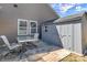 A patio area with seating next to the shed, perfect for outdoor storage at 7316 Strawberry Fields Ln, Charlotte, NC 28278