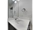 A bathroom with a round sink, vanity with faucet, mirror, and lights above at 8906 Paddle Oak Rd, Charlotte, NC 28227
