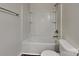 Bathroom featuring a shower with soap and shampoo shelves, toilet, and towel rack at 8906 Paddle Oak Rd, Charlotte, NC 28227