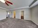 Large main bedroom featuring carpet and a tray ceiling at 8906 Paddle Oak Rd, Charlotte, NC 28227