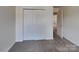 Bedroom featuring neutral walls, carpet and a sliding door closet at 8906 Paddle Oak Rd, Charlotte, NC 28227