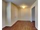 Spacious open-plan living room with hardwood floors at 8906 Paddle Oak Rd, Charlotte, NC 28227