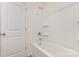Bathroom with white tub/shower combo and door at 8915 Myra Way # 39, Charlotte, NC 28215
