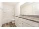 The bathroom has granite counters, white cabinets, and tub and shower combo at 8915 Myra Way # 39, Charlotte, NC 28215