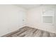Bedroom featuring plank flooring, window, and double door closet at 8915 Myra Way # 39, Charlotte, NC 28215