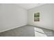Neutral bedroom filled with natural light from one window at 902 Westminster Dr, Statesville, NC 28677