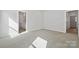 The spacious bedroom offers plush carpeting, and views from an en-suite bath at 902 Westminster Dr, Statesville, NC 28677