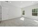 This large bedroom offers recessed lighting, neutral walls and carpet and views from two windows at 902 Westminster Dr, Statesville, NC 28677