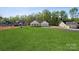 New construction home featuring a well-manicured lawn, and a newly paved driveway at 902 Westminster Dr, Statesville, NC 28677