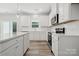 This bright kitchen offers white cabinets, stainless steel appliances, and lots of counter space at 902 Westminster Dr, Statesville, NC 28677
