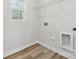 This laundry room includes a window and space for storage at 902 Westminster Dr, Statesville, NC 28677