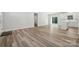 Open floor plan showcases new vinyl floors, an eat-in kitchen, and sliding glass doors to a backyard at 902 Westminster Dr, Statesville, NC 28677