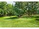 Expansive backyard with mature trees, offering privacy and natural beauty at 10625 Olde Irongate Ln, Mint Hill, NC 28227