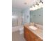 Well-lit bathroom featuring vanity with granite countertop and shower-over-tub combination at 10625 Olde Irongate Ln, Mint Hill, NC 28227