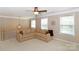 Upstairs living area with cozy sofa, chandelier, and windows offering natural light at 10625 Olde Irongate Ln, Mint Hill, NC 28227