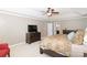 Relaxing main bedroom with a tray ceiling and cozy chair, providing an inviting retreat at 10625 Olde Irongate Ln, Mint Hill, NC 28227