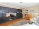 Well-appointed office with custom built-in cabinetry, hardwood floors, and ample workspace at 10625 Olde Irongate Ln, Mint Hill, NC 28227