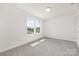 Bright bedroom with soft carpeting and a large window, offering a cozy and well-lit environment at 11032 Gary Player Dr # 961, Lancaster, SC 29720