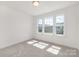 Sunlit bedroom with plush carpeting and a large window, providing a bright and comfortable space at 11032 Gary Player Dr # 961, Lancaster, SC 29720