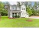 Charming two-story home featuring gray siding, black shutters, and a well-manicured lawn at 11032 Gary Player Dr # 961, Lancaster, SC 29720