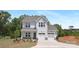 Charming two-story home with a two-car garage and beautifully landscaped front yard at 11032 Gary Player Dr # 961, Lancaster, SC 29720