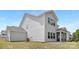 Side view of a light gray home with a screened-in porch at 11032 Gary Player Dr # 961, Lancaster, SC 29720