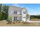 Inviting two-story home with a well-manicured lawn and a convenient two-car garage at 11032 Gary Player Dr # 961, Lancaster, SC 29720