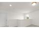 Upstairs hallway with view from top of stairs and ample lighting at 11032 Gary Player Dr # 961, Lancaster, SC 29720
