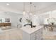Bright and spacious kitchen with a quartz island and hardwood floors, seamlessly connected to the living and dining areas at 11032 Gary Player Dr # 961, Lancaster, SC 29720