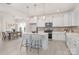 Modern kitchen with white cabinets, stainless steel appliances, and an island, open to the dining area at 11032 Gary Player Dr # 961, Lancaster, SC 29720