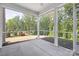 Enclosed screened porch with a concrete floor, offering an outdoor living area with views of the private backyard at 11032 Gary Player Dr # 961, Lancaster, SC 29720