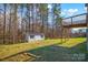 Spacious backyard with a shed and a raised deck, perfect for outdoor activities and storage at 111 Bell Chase Ln, Statesville, NC 28677