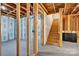 Unfinished basement features framing, insulation, and a staircase at 111 Bell Chase Ln, Statesville, NC 28677