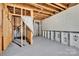 Unfinished basement space with exposed framing, insulated walls, and concrete flooring at 111 Bell Chase Ln, Statesville, NC 28677